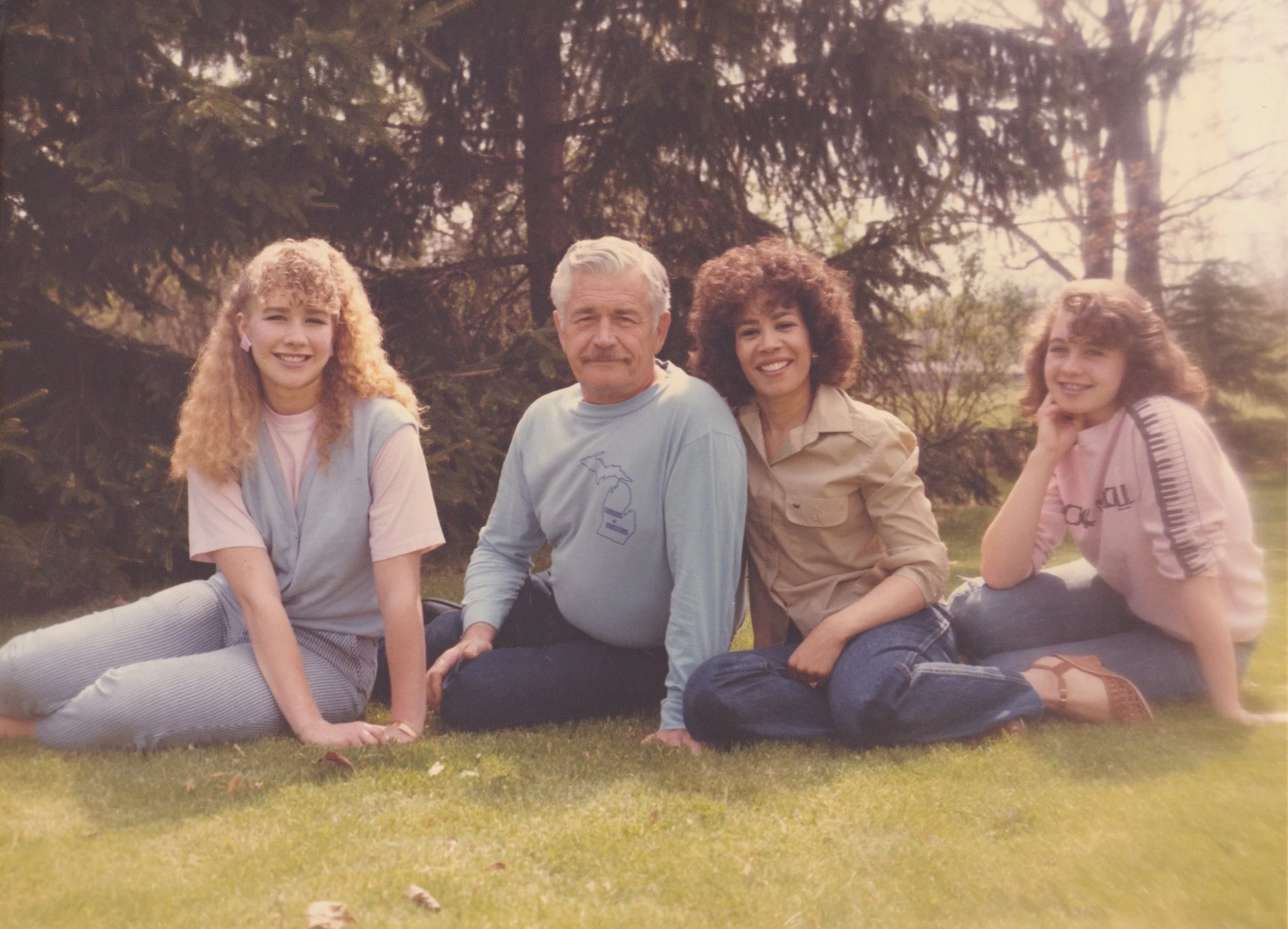 That's our family in 1986 in our backyard in Okemos, Michigan. Our father, Thomas Lee Atkins, was a Roman Catholic priest for 15 years. Our mother, Marylin Atkins, was the organist at his parish. She's also black and 25 years younger than him! They married pre- Loving v. Virginia . After she retired from her position as Chief Judge of Detroit's 36th District Court, she wrote her memoir, The Triumph of Rosemary , chronicling her life from her adoption till now, including what she and our father went through when he left the priesthood and they married and had us! Check it out here . Our father kept a journal his whole life, so we are a family of writers. Although he died in 1990, we keep him alive in our conversations and memories of him. Besides, he's always with us in spirit. We know that without a doubt!