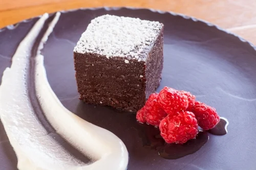 Flourless chocolate cake with raspberries and creme fraiche
