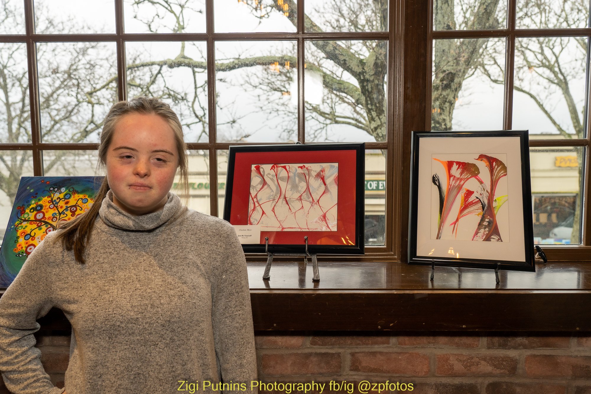  Spec Wired artist, Charlotte, proudly stands by her artwork. 