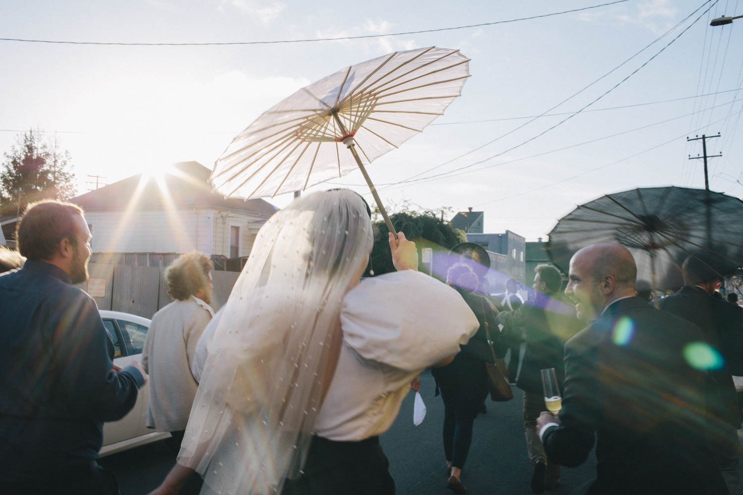 a couple dances in the street during their wedding reception in oakland