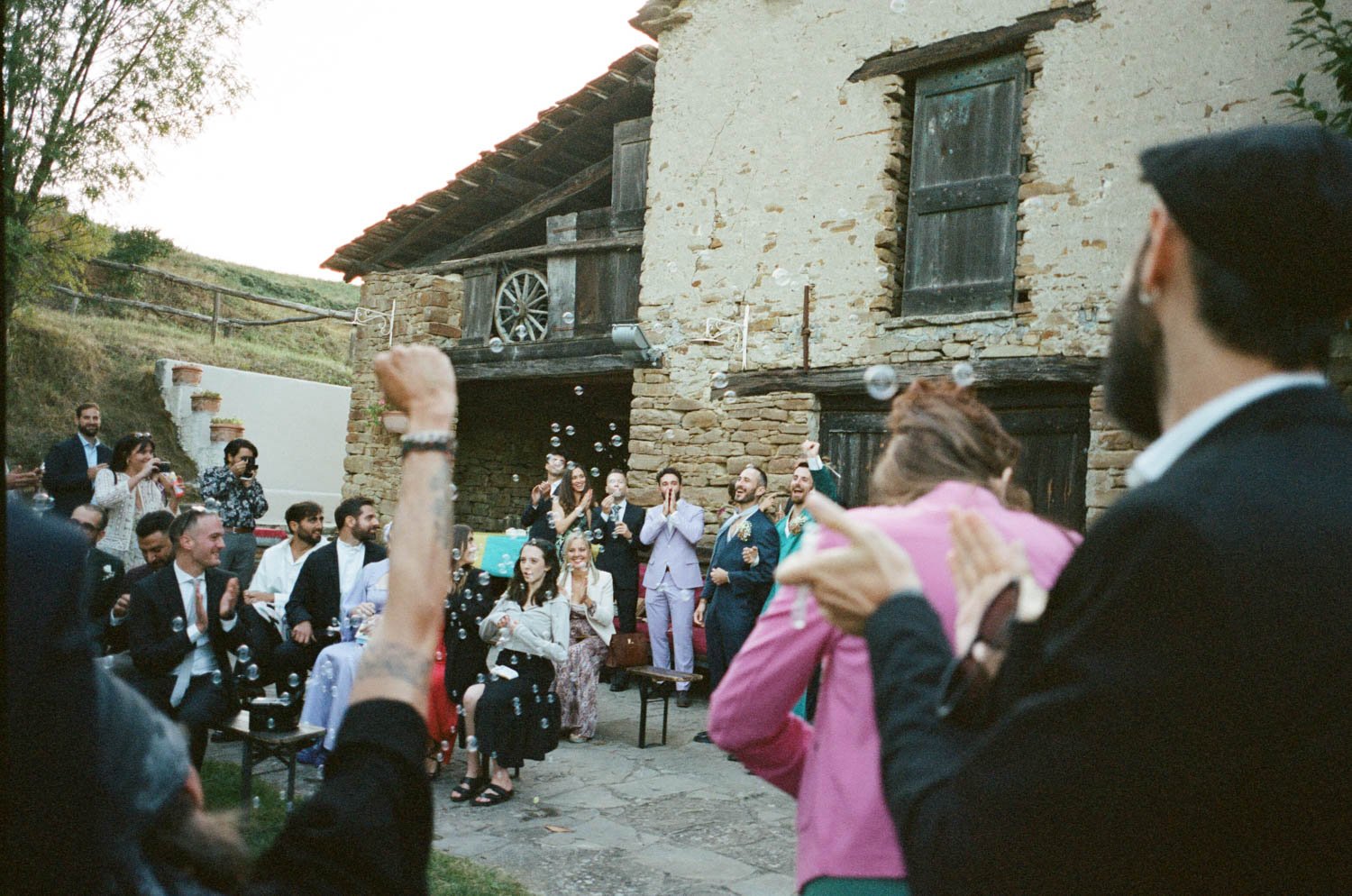 Queer love and celebration after the ceremony at La Cascina Langa in Italy