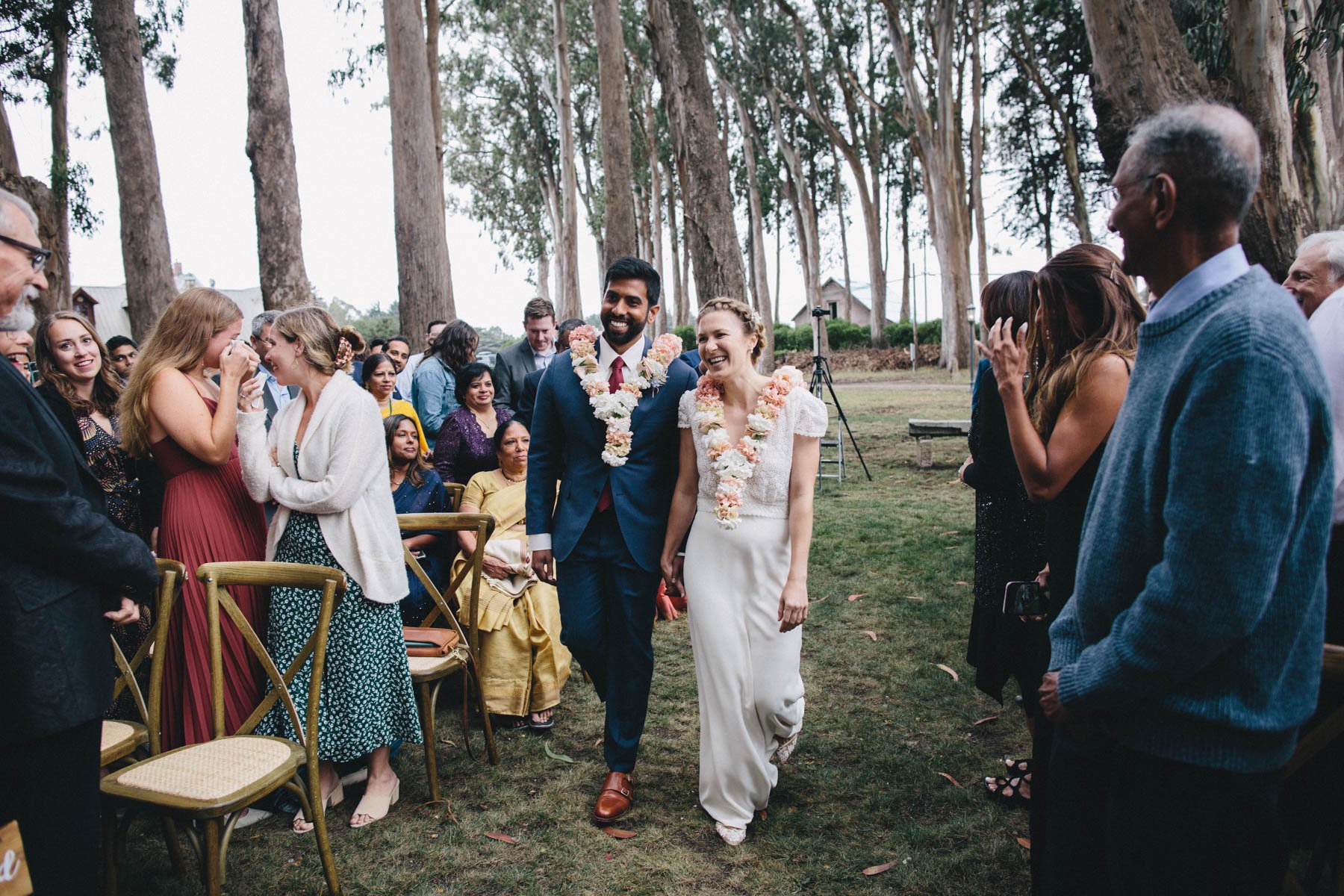 Bride and groom enter their wedding ceremony together