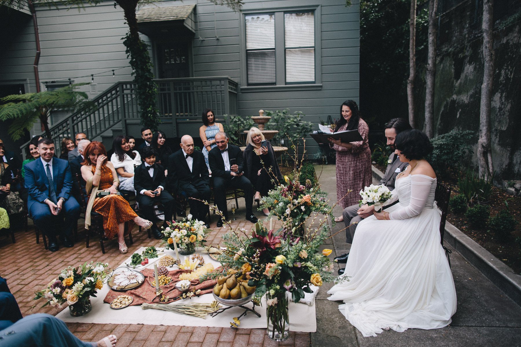 A couple getting married in a Persian ceremony at Haas-Lilienthal House in San Francisco
