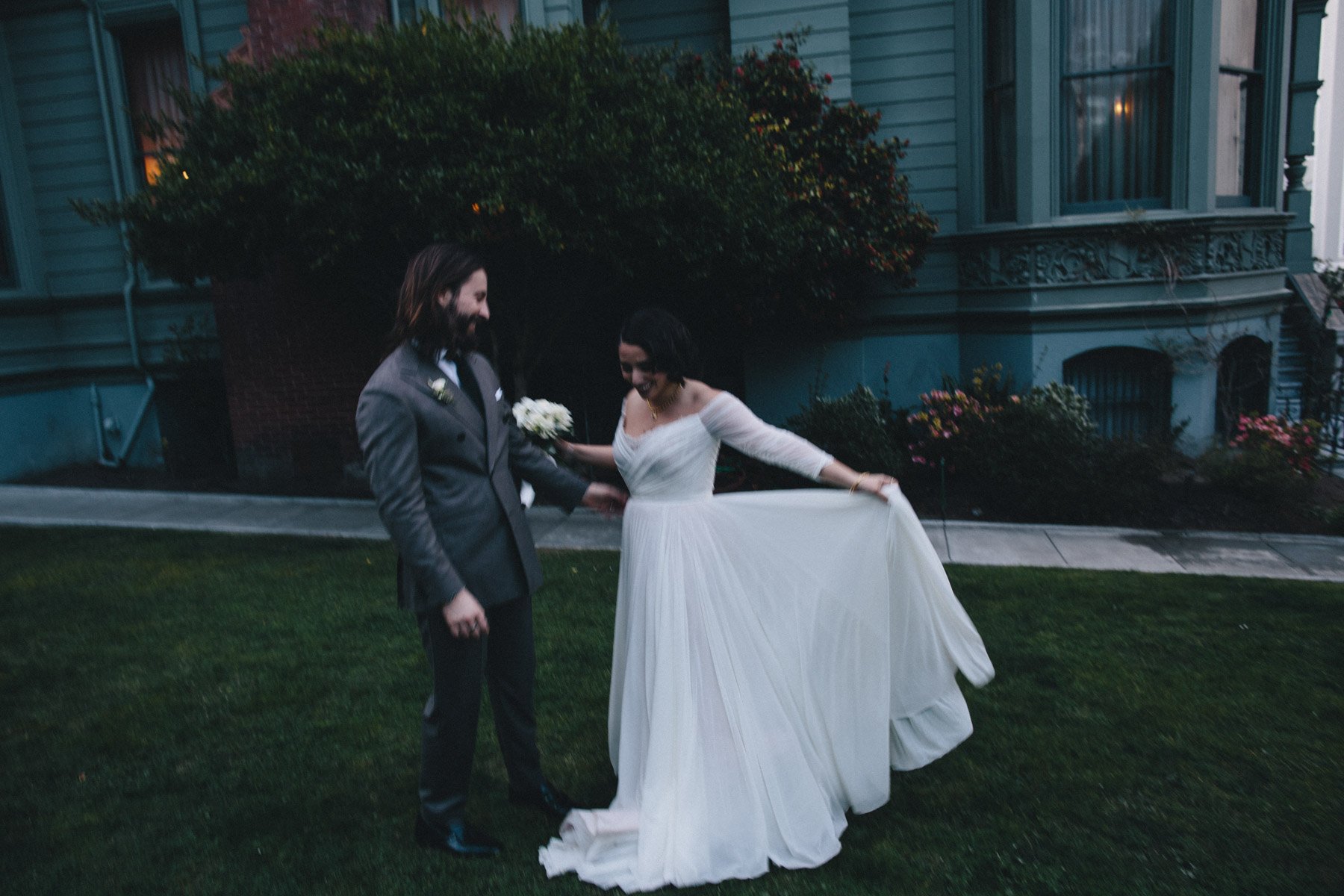 A bride and groom after their wedding ceremony in front of Haas-Lilienthal House