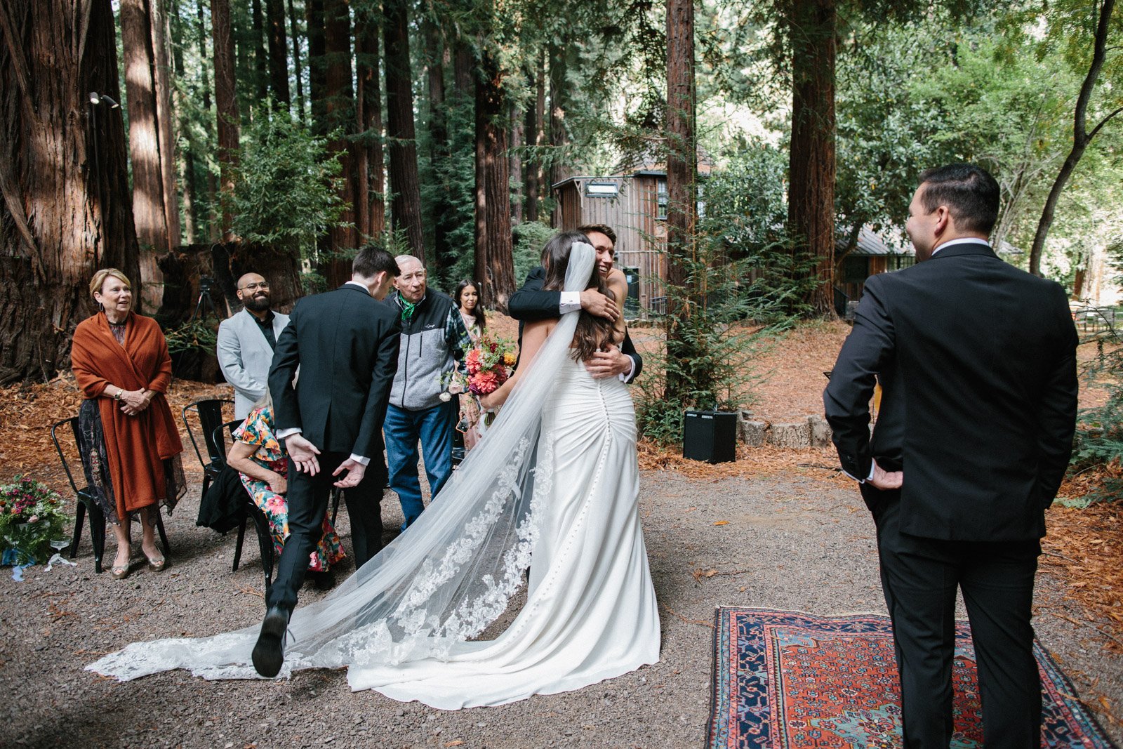 A bride hugs her brother before the ceremony begins