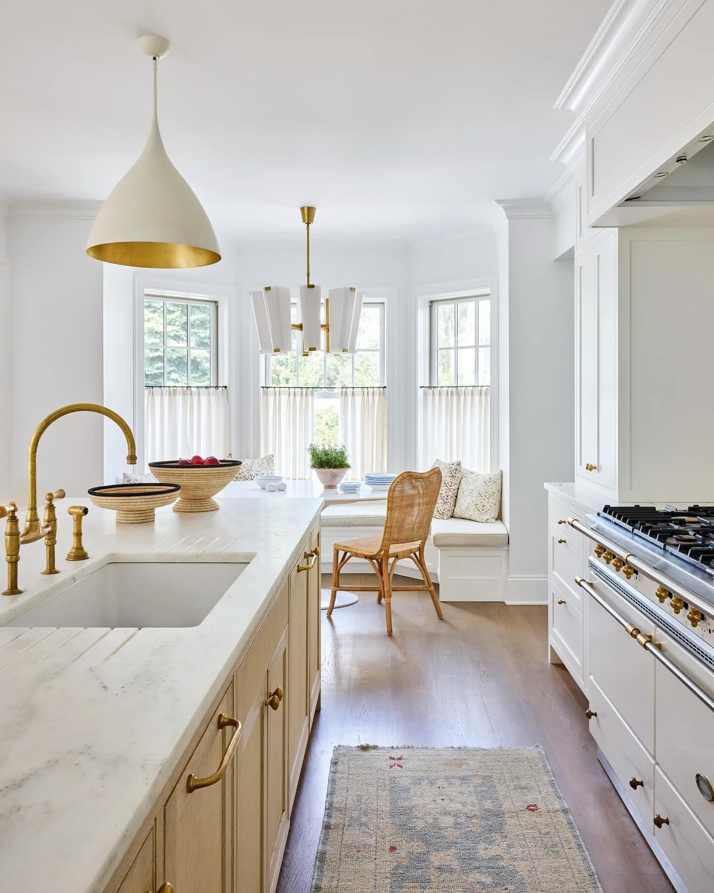 Not just another white kitchen ~ quiet, thoughtful details make this an elegant and serene space. 

A highlight✨Inspired by the clients recent travels in Europe we cut drain grooves into the Danby marble countertops flanking the sink to use for resti