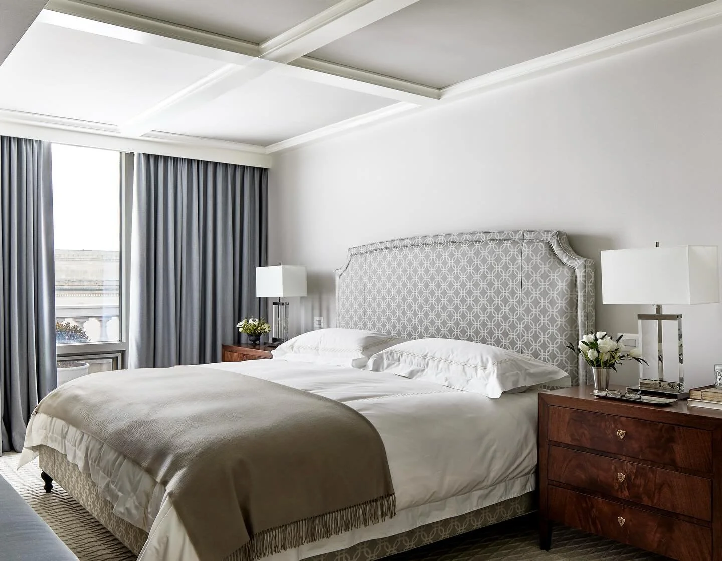 A polished primary bedroom with penthouse views. 

Photo @stacyzaringoldberg