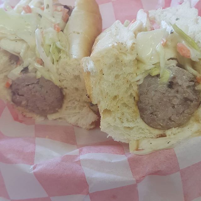 Here's our newest delicious creation. Fresh made pineapple jalapeno pork sausage topped with Thai slaw.  Yum
