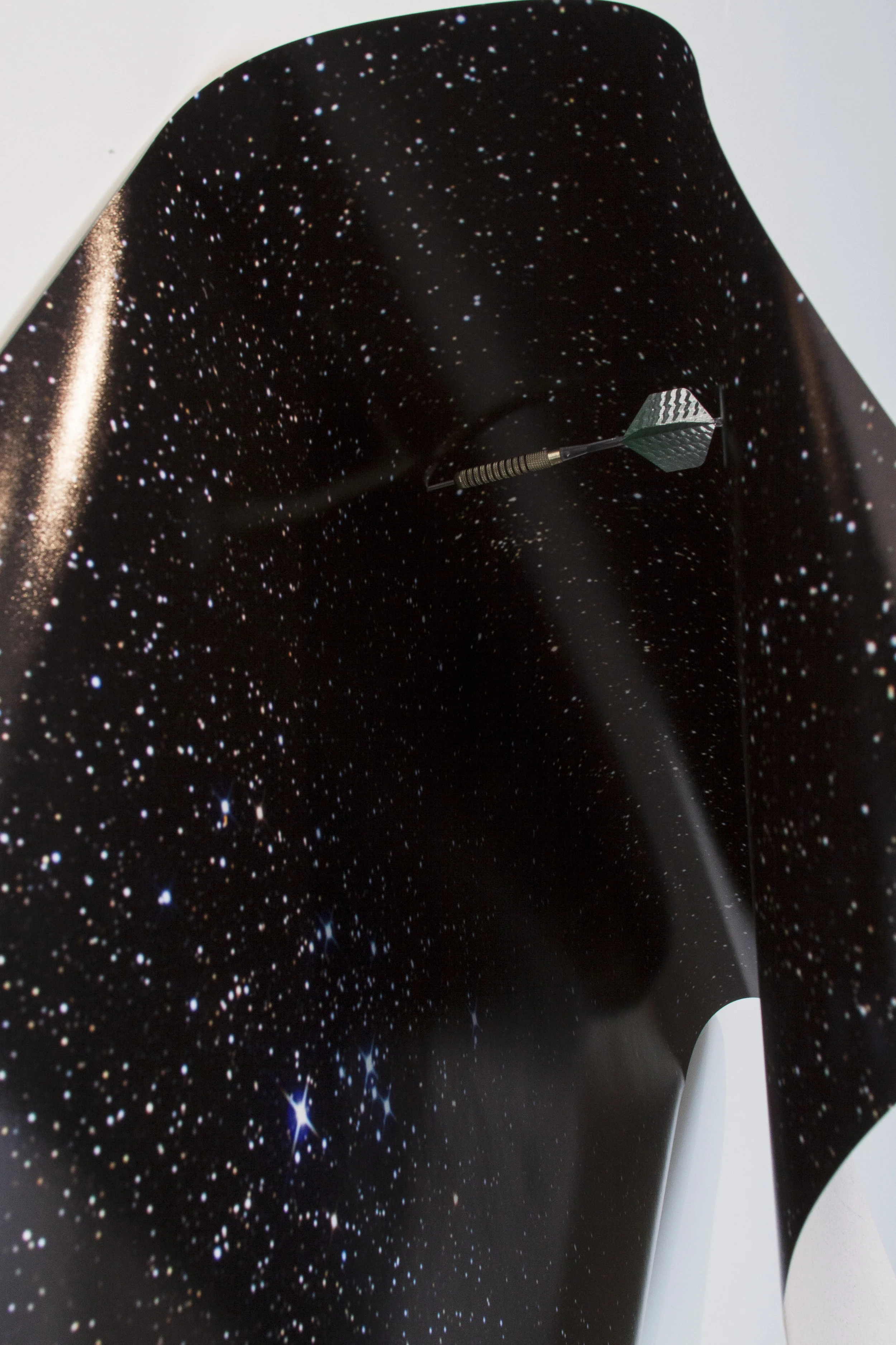 Joseph Rykniewicz Lucky Star, 2012 Archival inkjet print and throwing dart Dimensions variable
