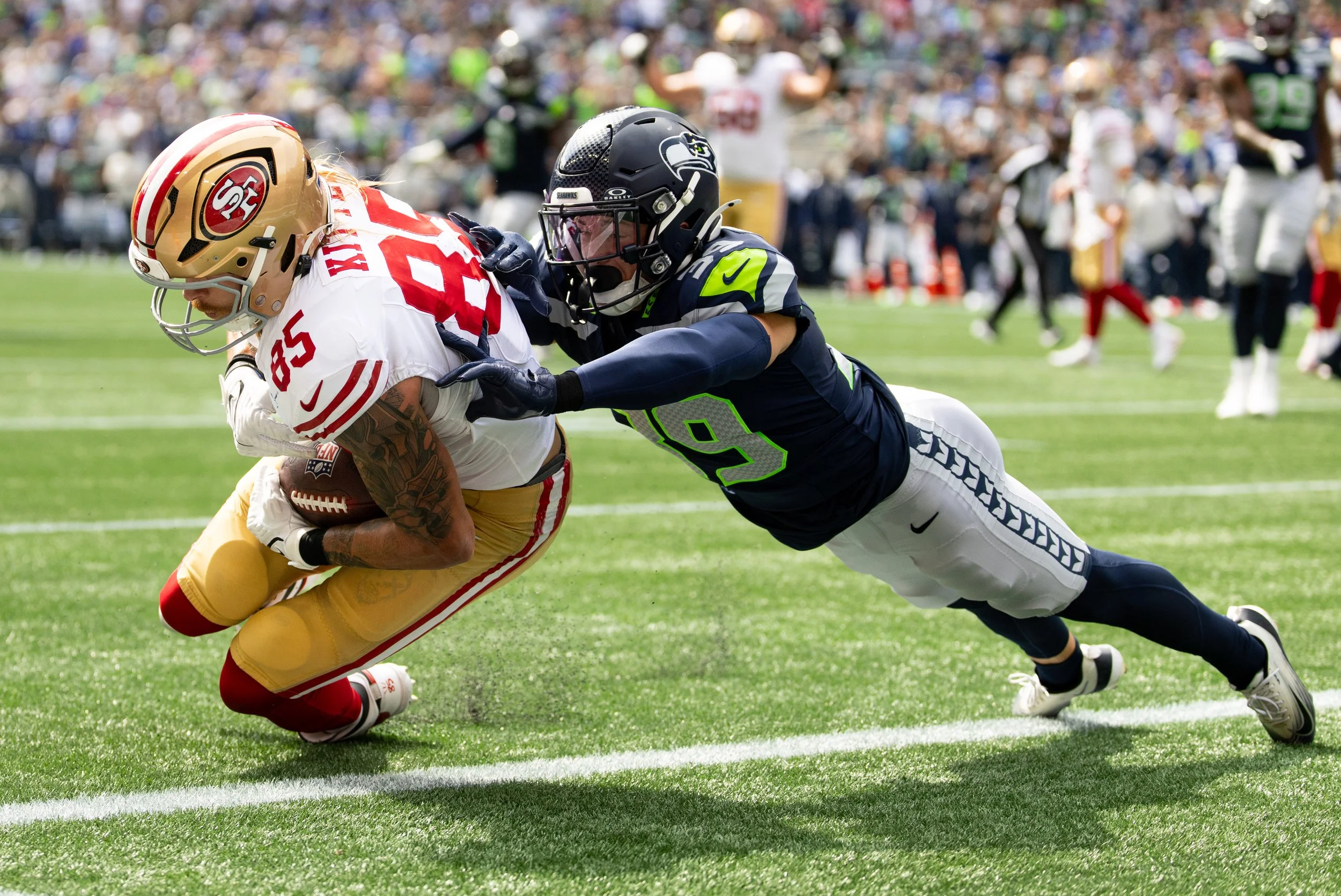 George Kittle scores a touchdown - The Standard