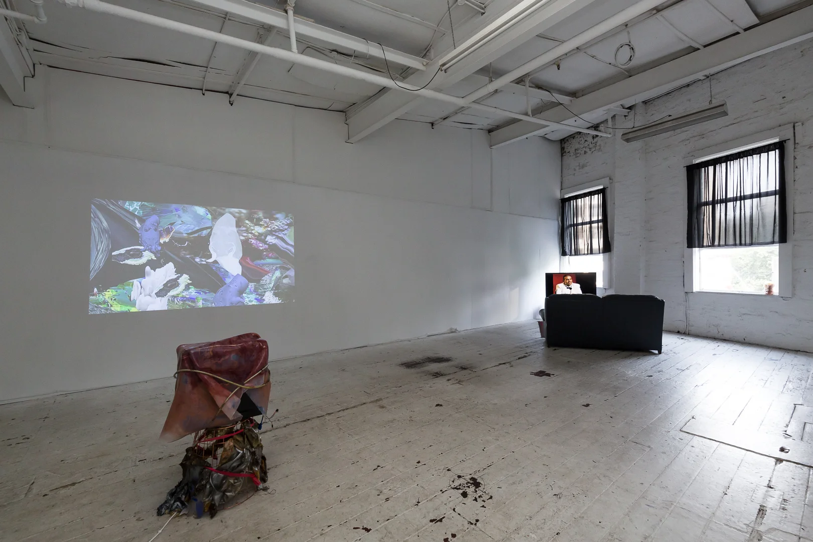 (left) Marian Tubbs, Suprasubliminals , 2018, digital video, silicone, latex, pigment, spray paint, computer tower, waste basket; (right) Ann Hirsch, Here for you (Or my Brief Love affair with Frank Maresca), 2011, digital video, Currency, Lilac City Studio, Sydney. Photo: Document Photography