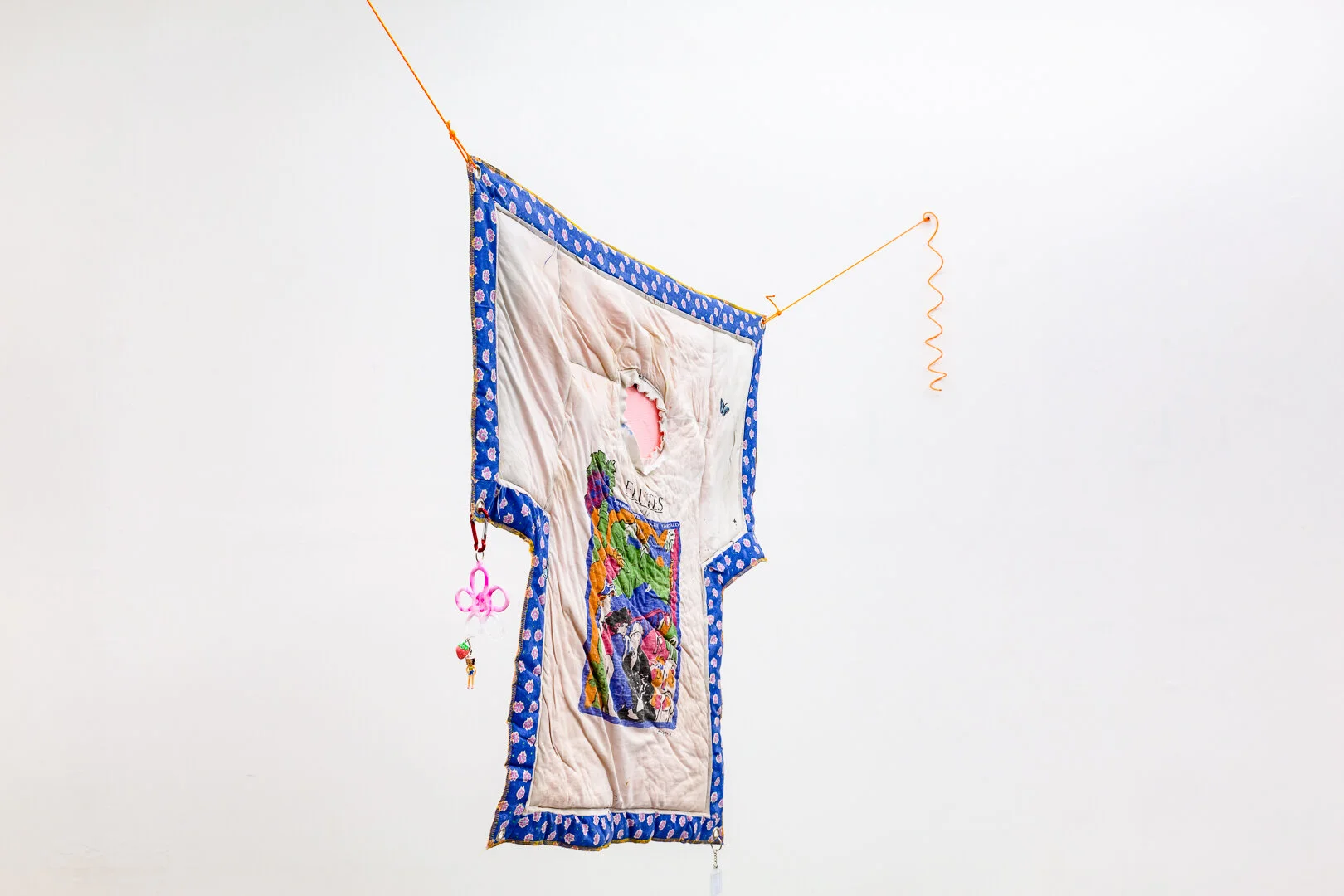 Amelia Skelton, Shroud: 2010-2019 , 2020, resin keyrings, artists t-shirt, second hand fabric, ink on cotton, thread, found acrylic, metal eyelets, rope, found earring, and found charm, All that you can call your own you can say that you are, Pa