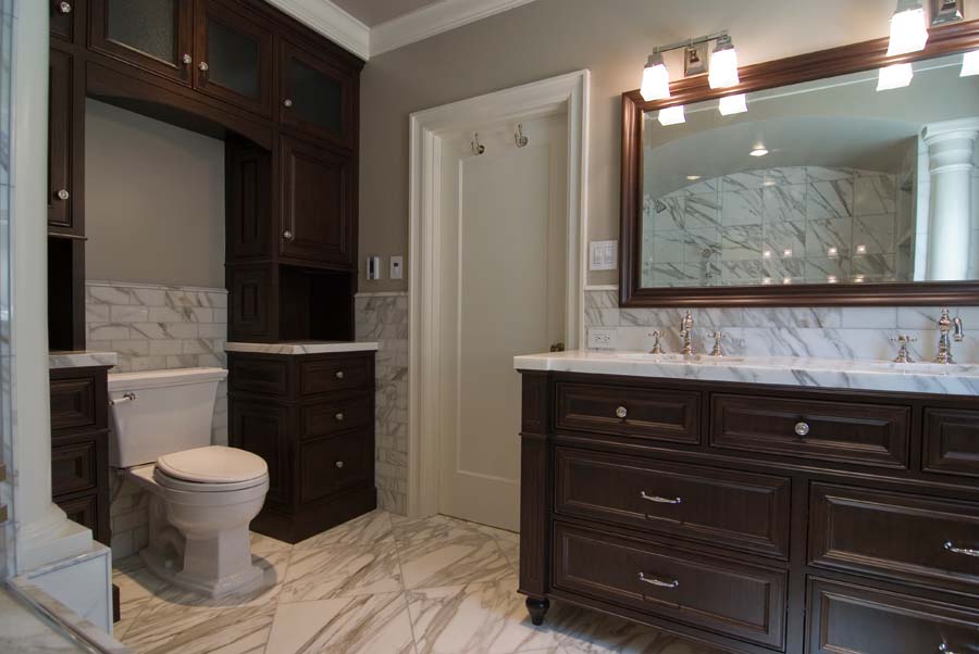 Stained walnut and marble bathroom