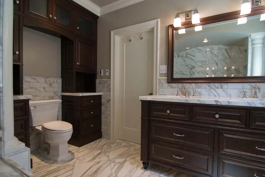 Stained walnut and marble bathroom