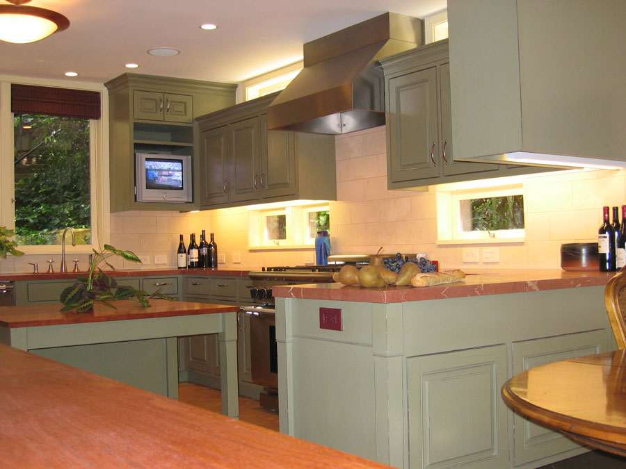 Distressed painted kitchen with hand-fitted flush-inset doors and drawer fronts