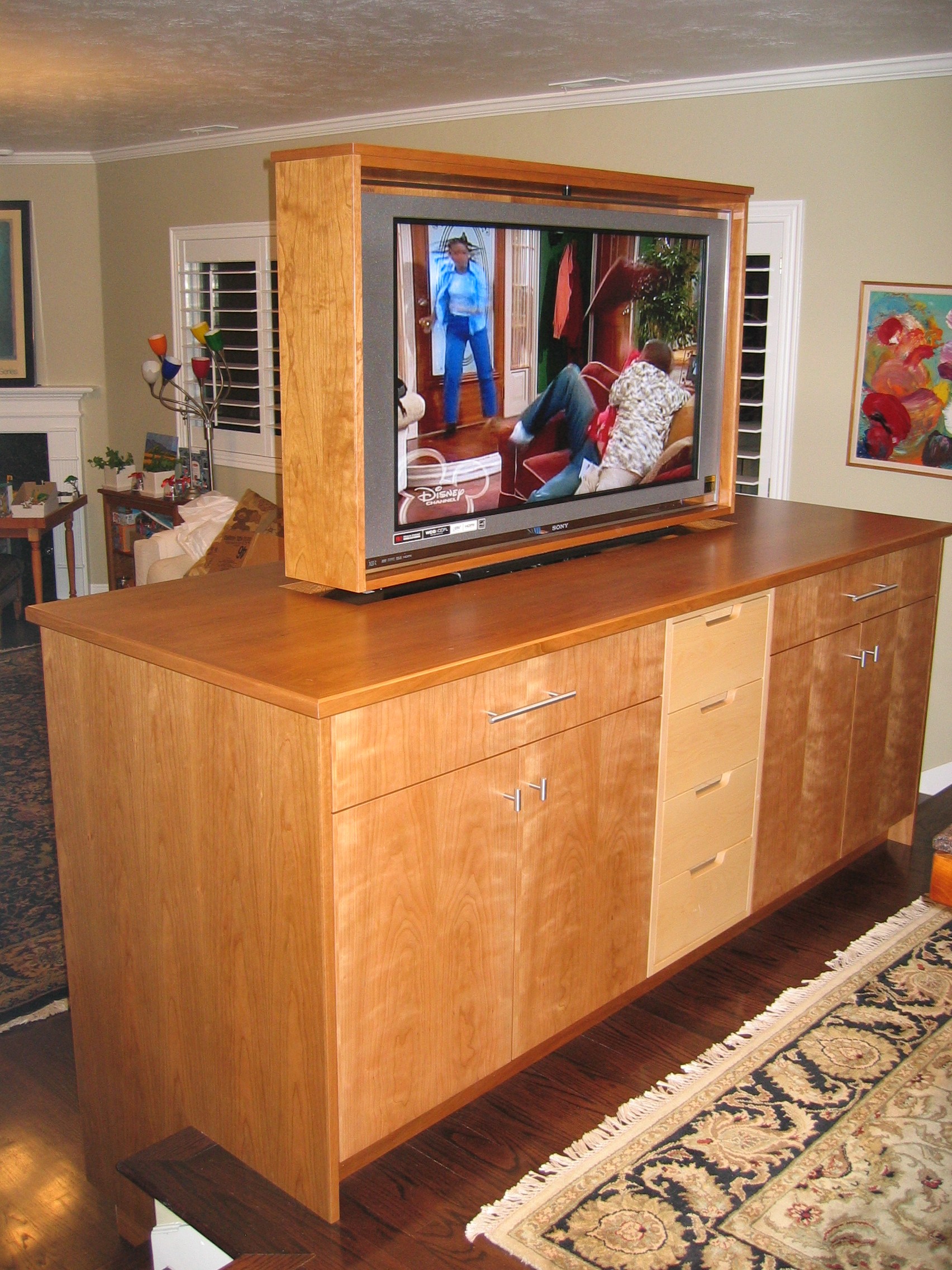 Cherry-maple pop-up, pivot TV cabinet