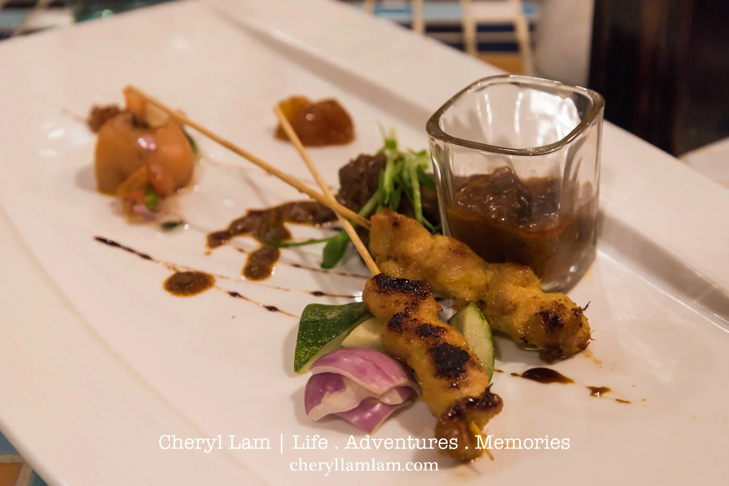 Surf & Turf - Broiled Angus beef rendang, foie gras, salmon ball Serunding, chicken satay with peanut dip, Edamame bean