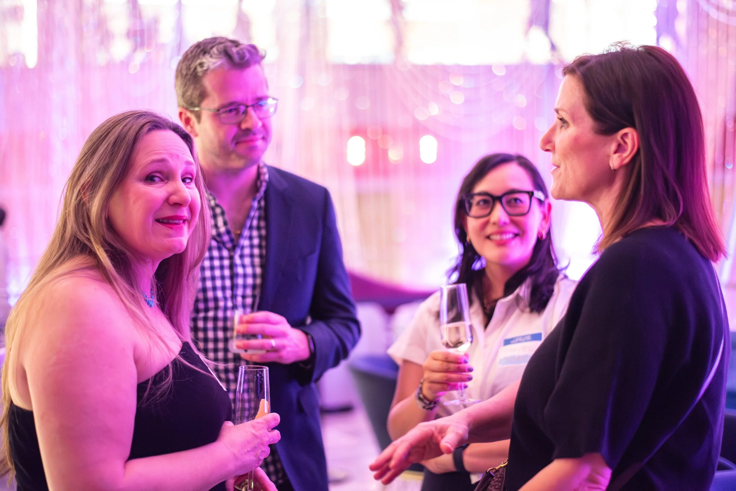 Attendees networking at the ICology Presidents Club Happy Hour at the Chandelier Bar, Cosmopolitan, Las Vegas, during Transform 2026.