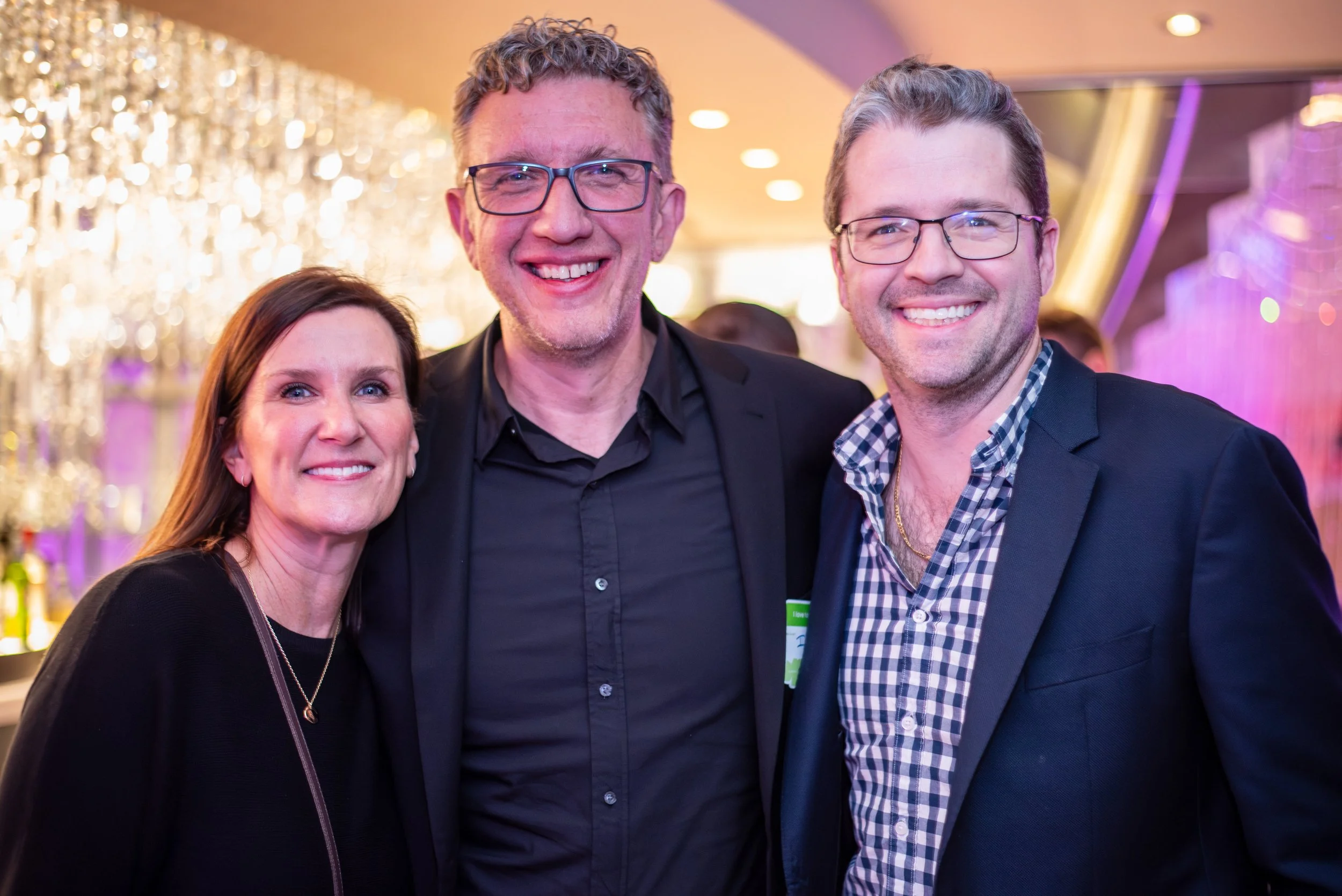 Jen Busch, Chuck Gose and Christian Coley at the ICology Presidents Club Happy Hour at the Chandelier Bar during Transform 2026.