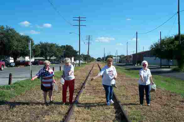 Seeding the railroad tracks with bluebonnets.jpg