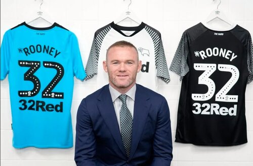 Rooney posing with his new number for Derby County. Credit: PA Press Association