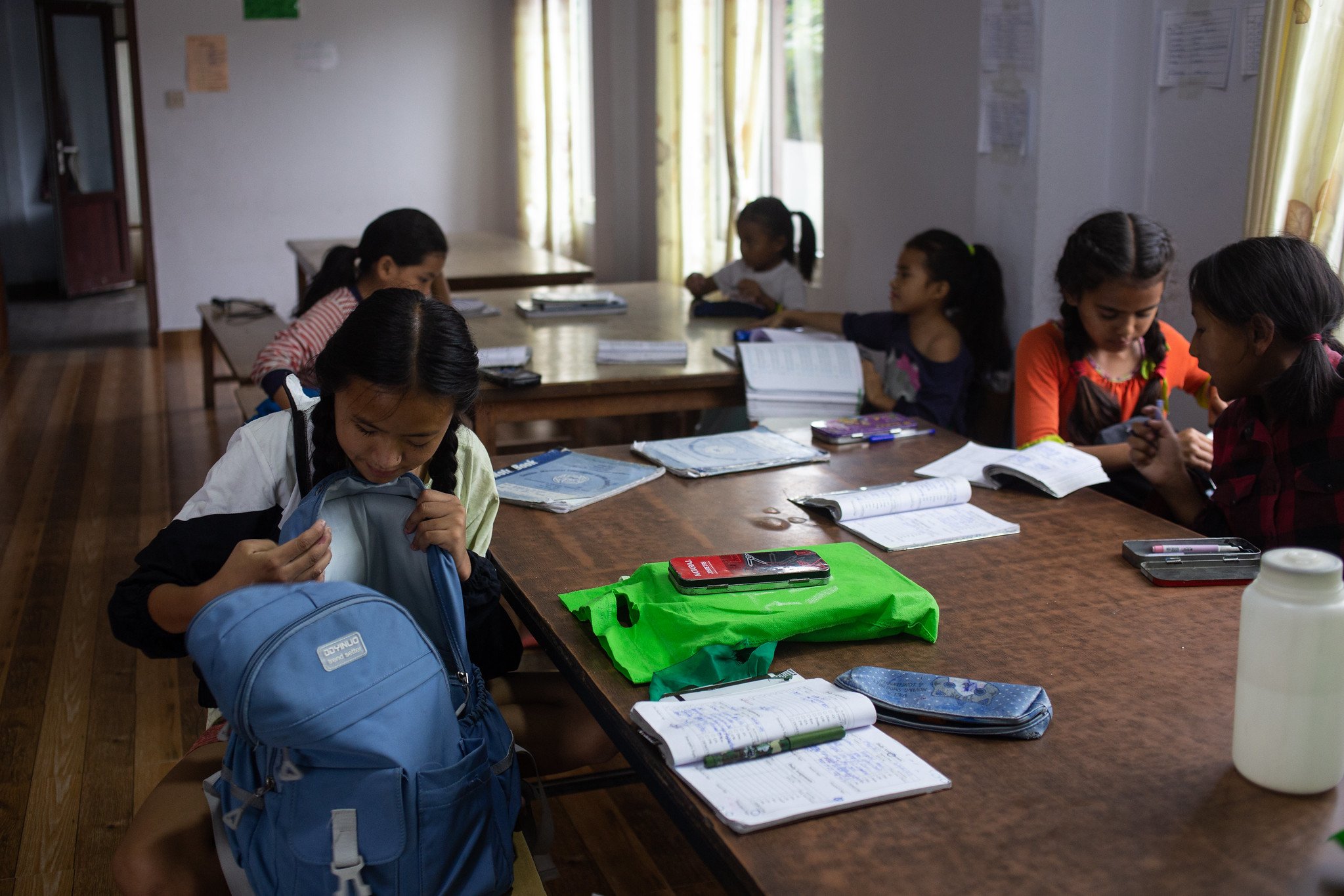  Girls do their homework together in the study room at their hostel in Kathmandu. (Photo by Uma Bista) 