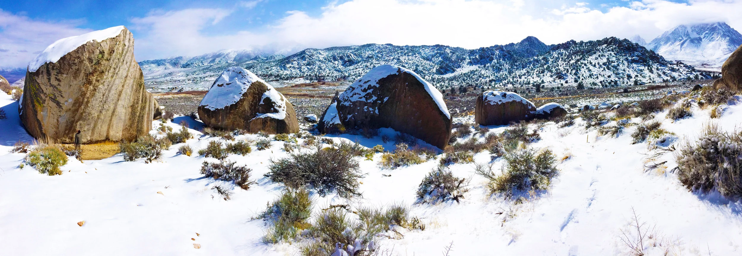 Chris (left) contemplating the likelihood of a send on The Mandala (V12) on a snowy late February morning in the Milks.
