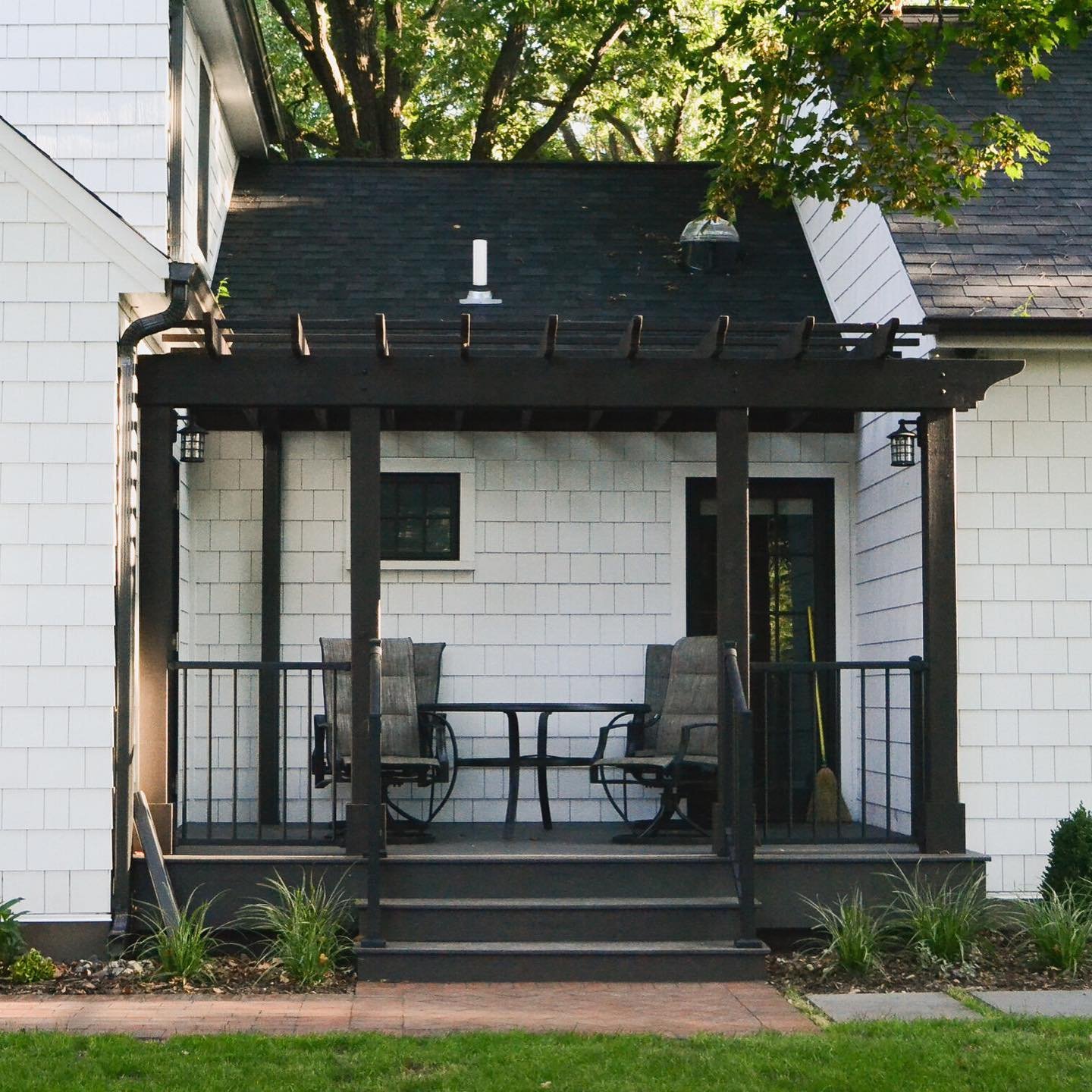 Who doesn&rsquo;t love a charming porch to look out on a yard like this? This Richfield Beauty home renovation begs to be enjoyed, with a porch perfect for sittin&rsquo; and stayin&rsquo; awhile. Just imagine yourself here, shaded by the majestic oak