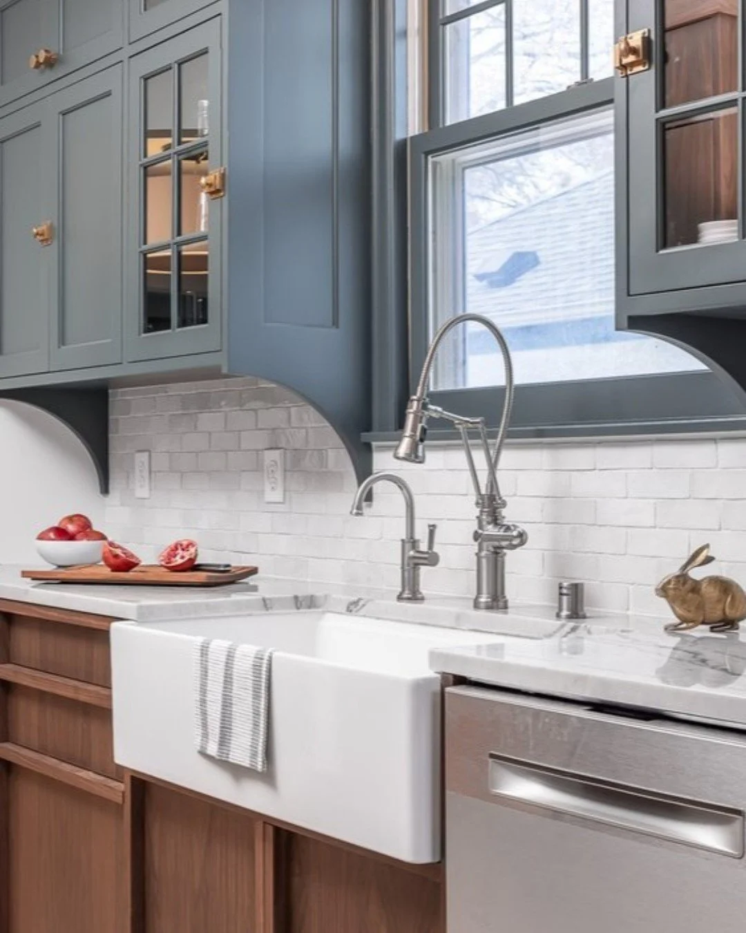 This kitchen sink brings a touch of farmhouse charm to this luxurious Hale Tudor kitchen. Complemented by floor-to-ceiling custom cabinets, a pristine backsplash, and marble countertops, it&rsquo;s the perfect feature for #TileTuesday!