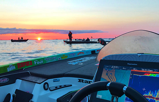 Spectator boats anxiously await their favorite pros at morning take-off