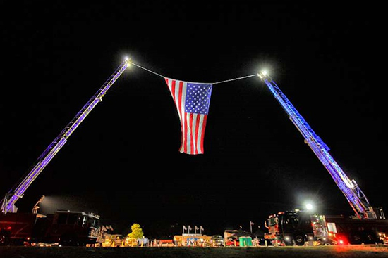 The local fire department raised this magnificent flag for our morning anthem.