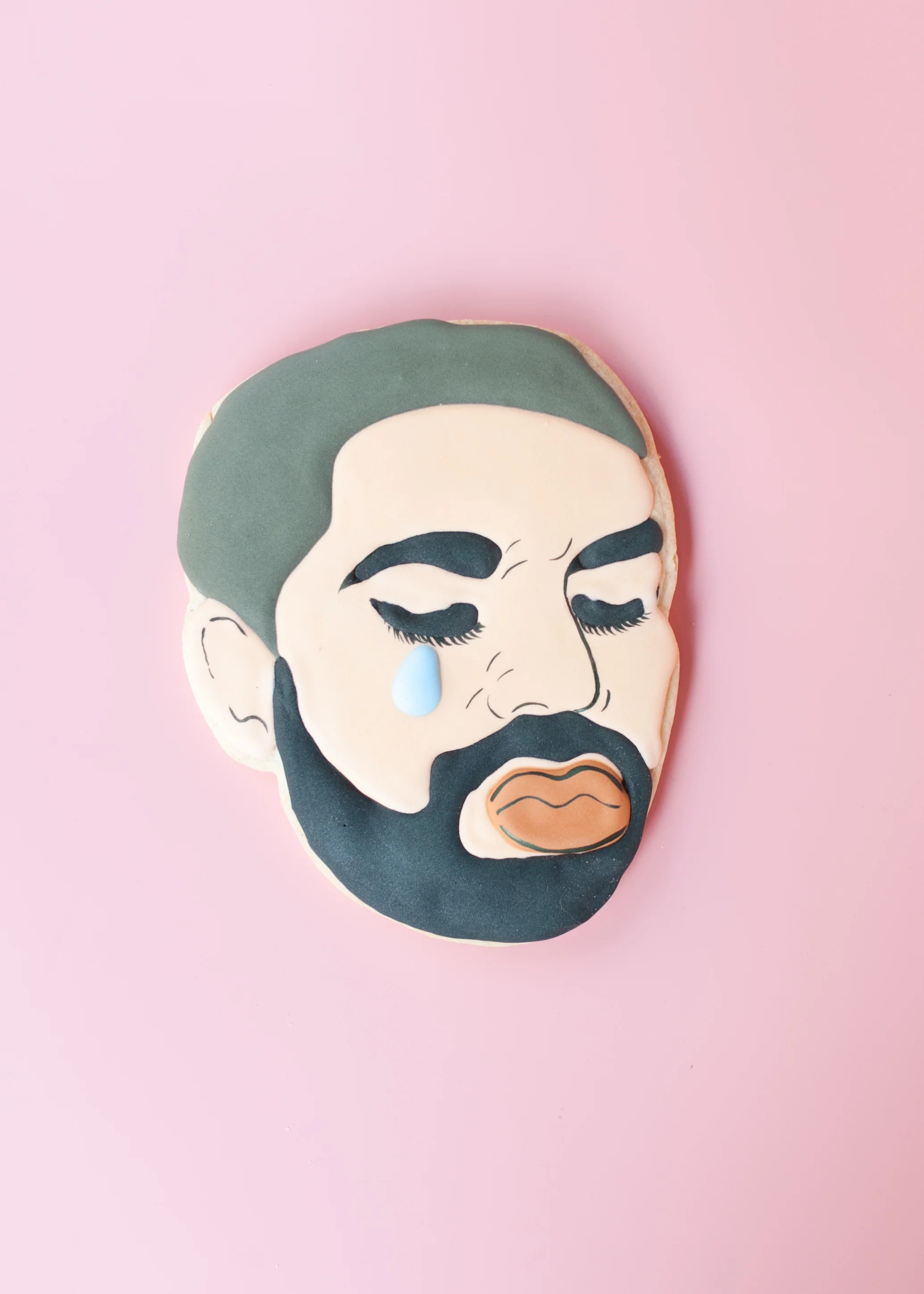 CUPCAKES + FACE COOKIES Cupcake Market While Cupcake Market has some of the best cupcakes in the city, their claim to fame are their iconic celebrity faces meticulously painted on sugar cookies. Drake's tears or Kim Kardashian's crying face are just a few of the options.
