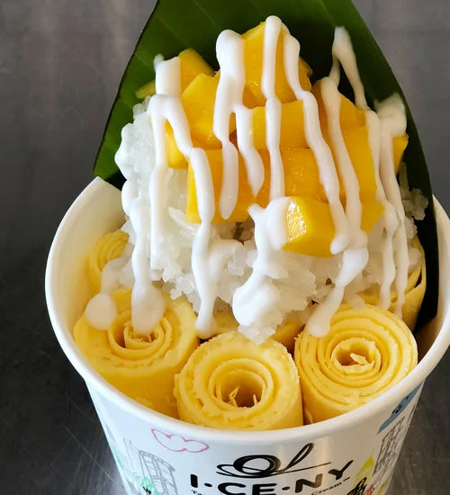 ROLLED ICE CREAM I CE NY I CE NY makes fresh ice cream that’s poured, frozen, smashed, and rolled right in front of you, in inventive flavors like mango sticky rice (with actual sticky rice on top!), Hong Kong milk tea, and Biscoff!