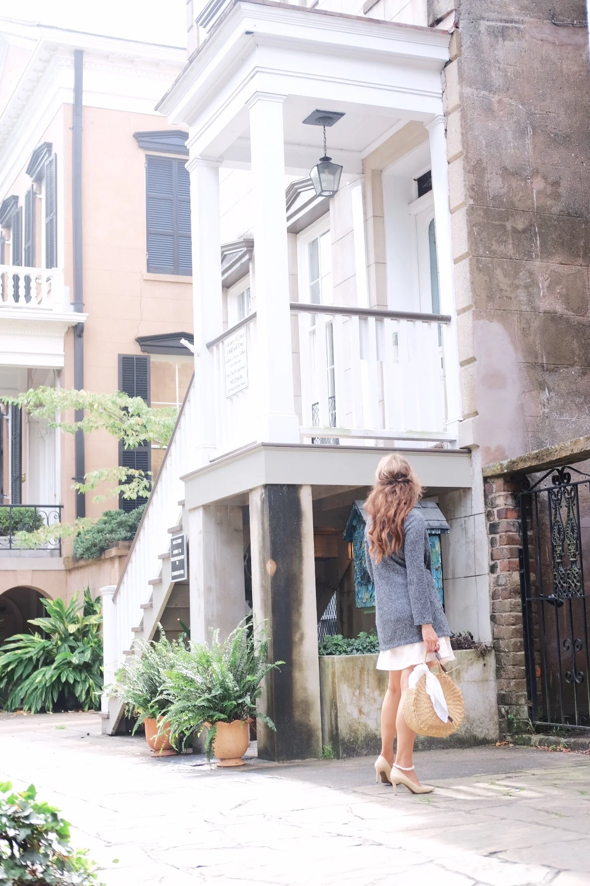 Brenna Lauren Michaels in Blush Pink Dress and tweed jacket outside of Flannery O’Connor Birthplace in Savannah, Georgia