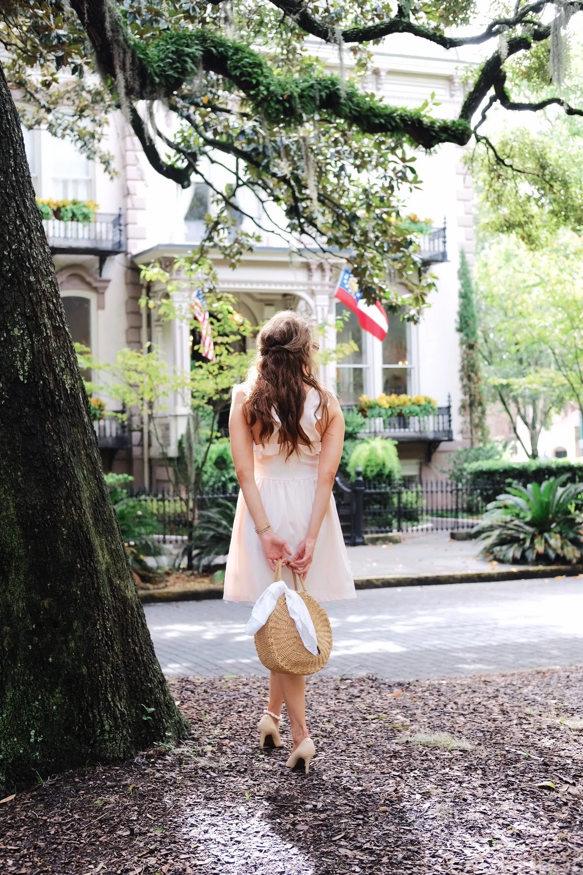 Brenna Michaels of Genteel & Bard stands beside a Live Oak tree in Savannah GA