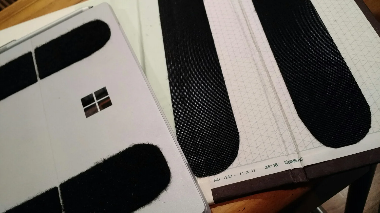 Mounting the cover was the toughest problem and biggest decision. I considered some adhesive options, some mechanical fastening systems. In the end Velcro strips provide me with secure, repositionable fastening. This arrangement also accommodates the awesome kickstand.