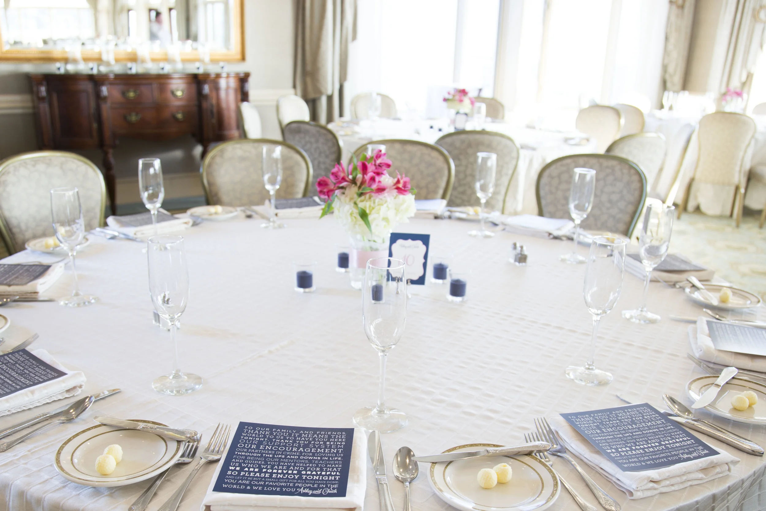 Ashley and Chuck | Atlantic Beach Club, Newport RI Event Design: www.champagneandink.com Photo: Joseph Laurin Photography | http://www.joelaurinphotography.com/ #newportri #newportwedding #champagneandink #joelaurin #bride #groom #pinkandnavy #beachwedding #wedding #weddingdress #weddingtable #centerpieces