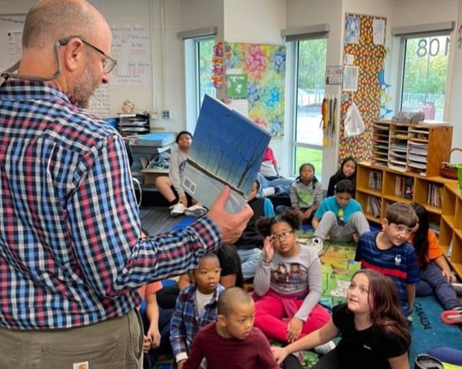 AEA President Corey Aist conducting a read-aloud at Mountain View Elementary