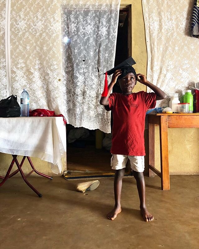 #WhyWeDoWhatWeDo Here&rsquo;s Peter, trying on Mama&rsquo;s graduation hat. Peter&rsquo;s mama is Sharon, a single parent who co-parents with her Mom looking after her many [biological and adopted siblings] as well as her son, Peter. Sharon graduated