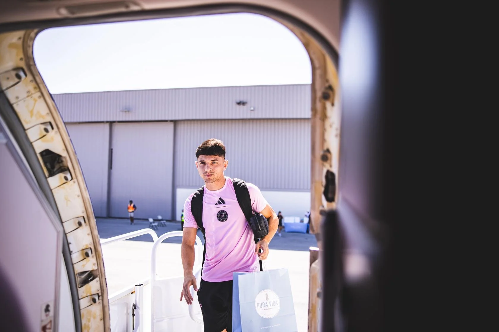 David Ayala Away Trip holding Pura Vida bag.jpg