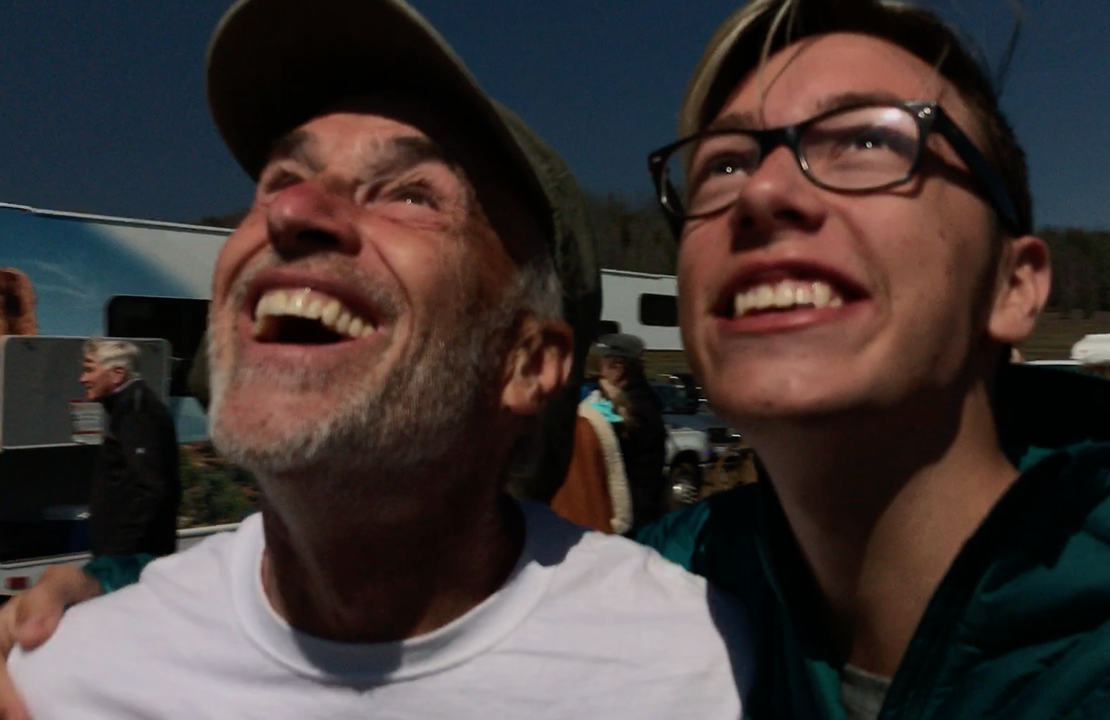 Just as the moon slipped into place my nephew Joey Torrison run up & someone captured this moment. You can SEE the eclipse not only in his glasses but in my eye.