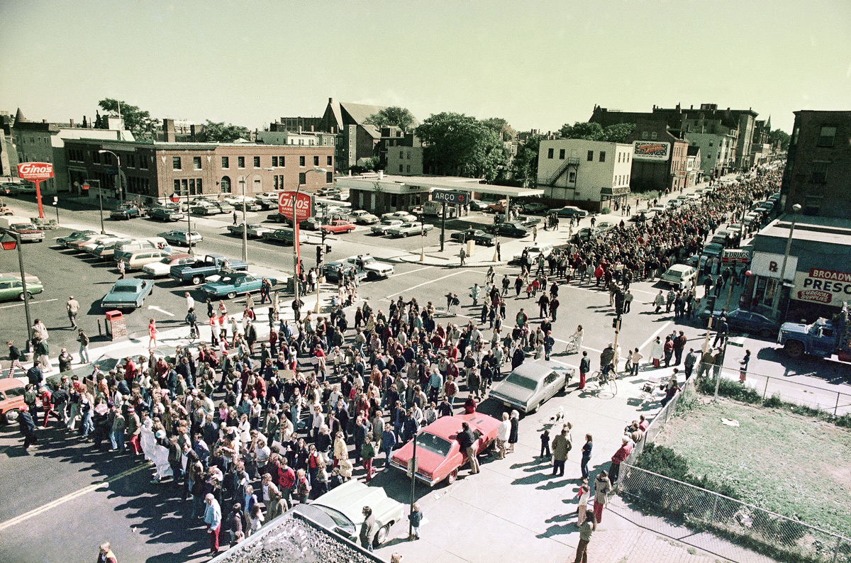 Anti-busing parents march in South Boston on Oct. 4, 1974, along with students in protest of African-American students being bused into the South Boston school district. About 5,000 people took part in the march. AP Photo/J. Walter Green