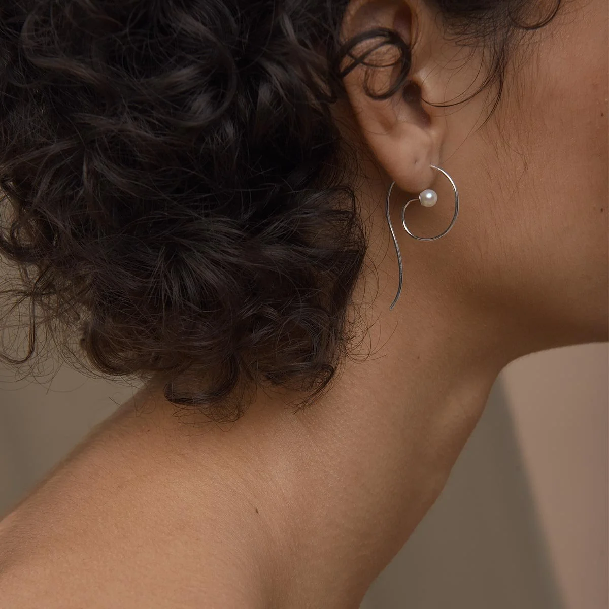 Small_coil_earring_on_model_for_web_1600x.jpg