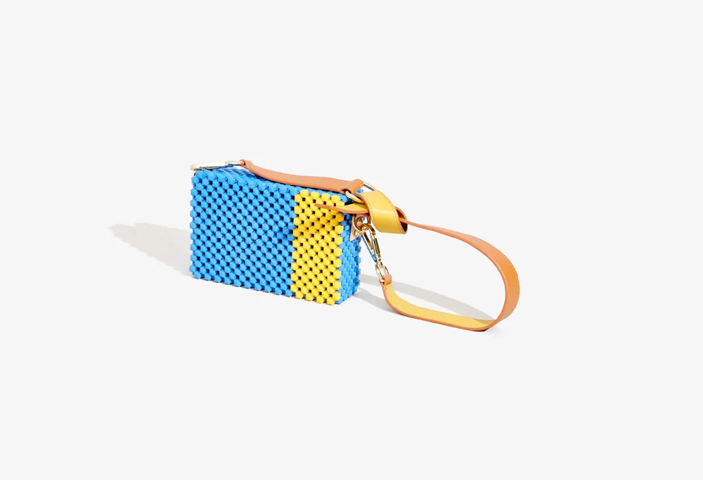 Metamorphosis Cocktail Clutch with Tan and Turmeric Handle.jpg