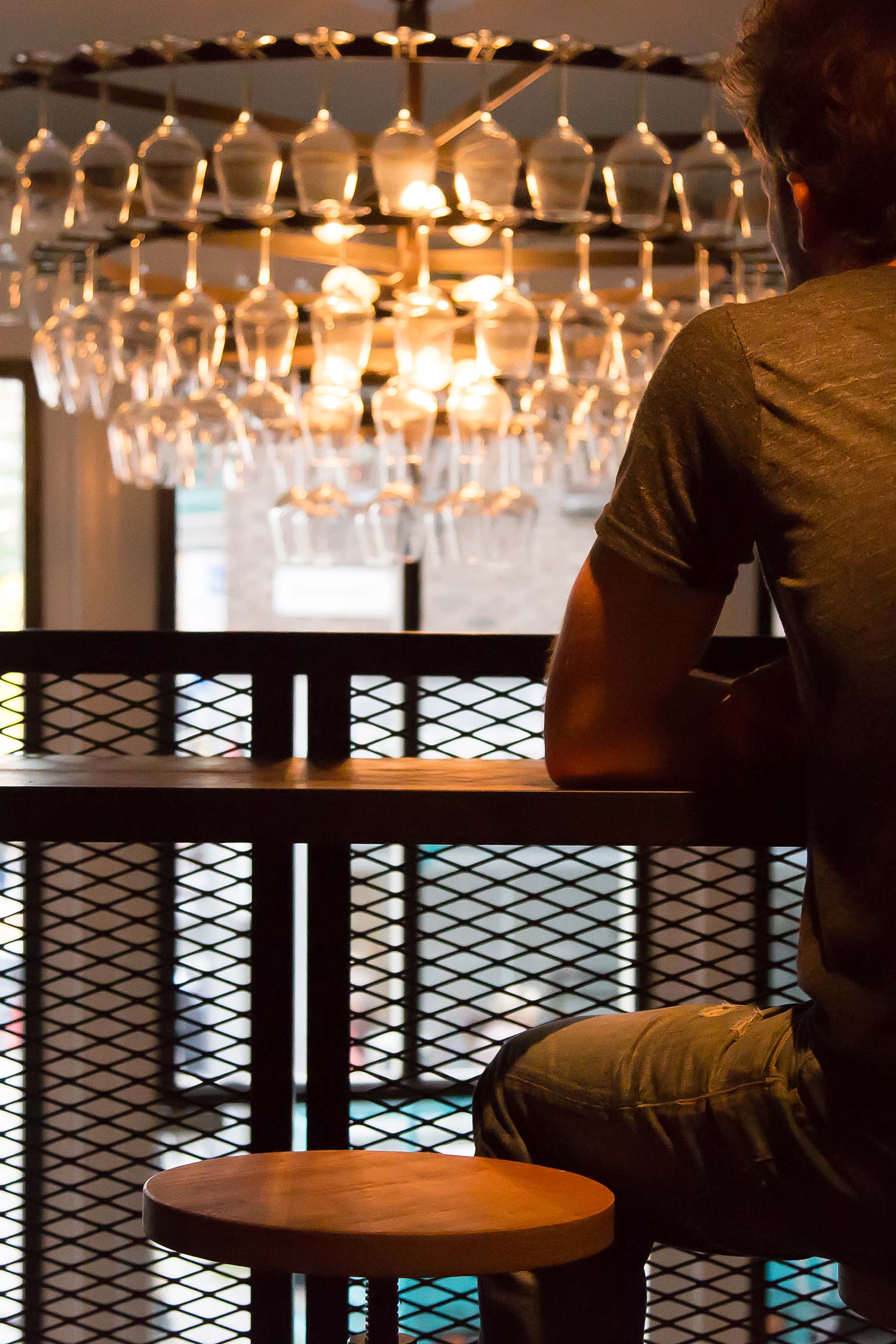 A chandelier of wine glasses deserves to be looked at!