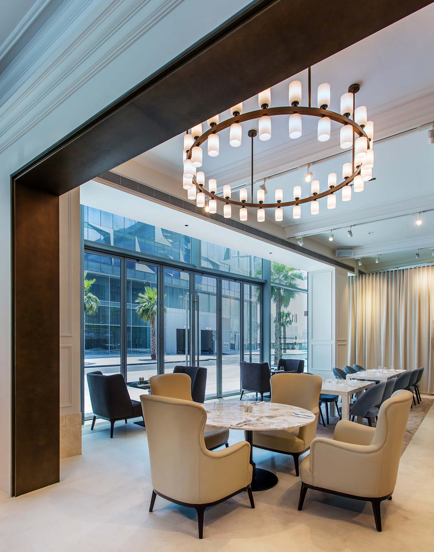 The café’s architecture is built around a timeless, neutral colour palette with fresh, feminine touches. The solidity of classic marble meets French inspired parquet, while light reflecting floors brighten up the entire space. Timeless, classic accents and graceful seating elements complete the café in style. ›Dubai ›Client Marka ›In collaboration with Atelier Elliott and AofS ›Photography Interior Seeing Things ›Graphic design Design and Practise ›Photography Graphic design Arne Jennard