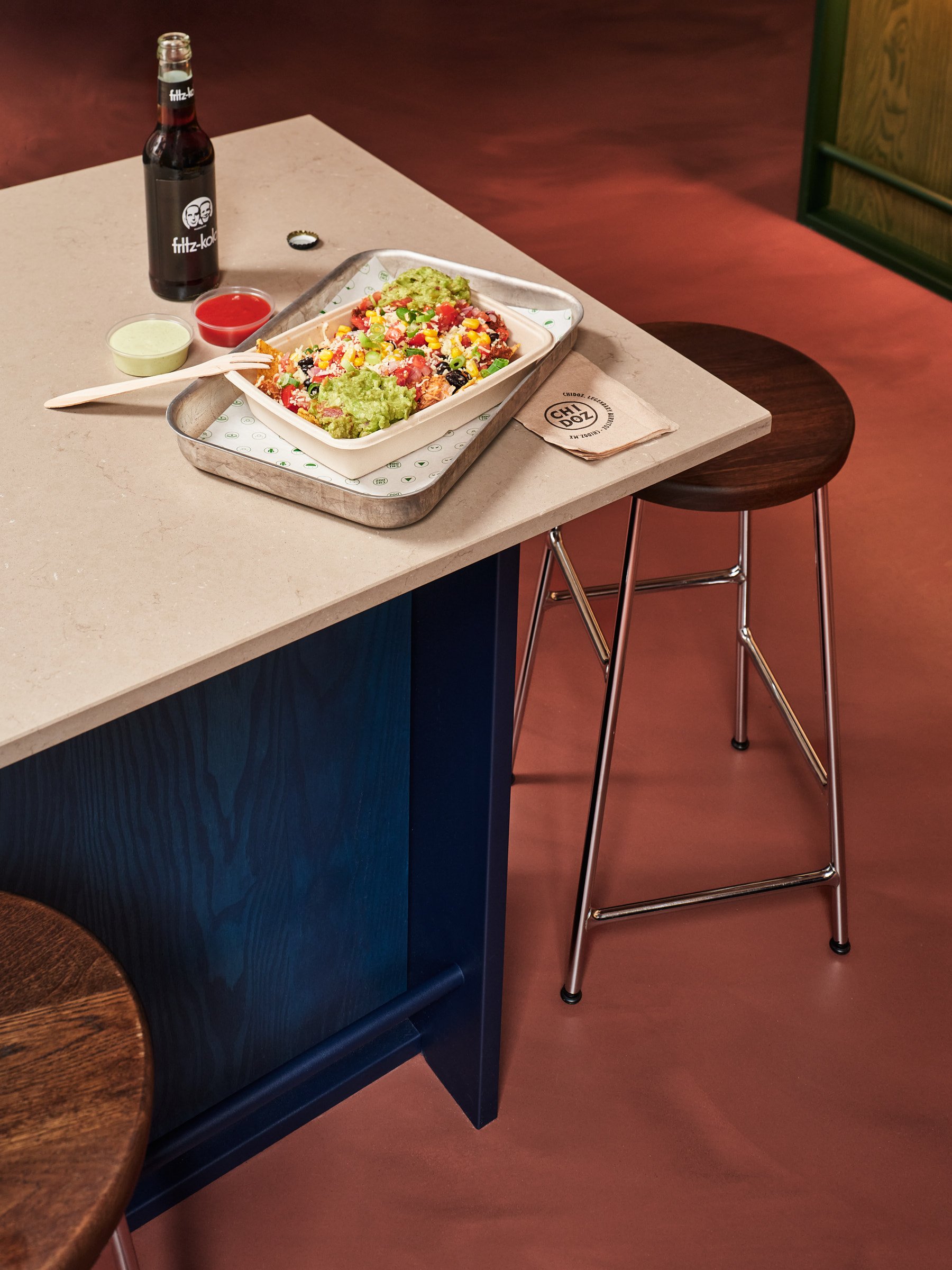  Earthy tones, textured walls, stained timber, metal and tactile finishes create a layered material palette. Bold colour accents add character, while clean architectural lines bring clarity and balance to the space. 