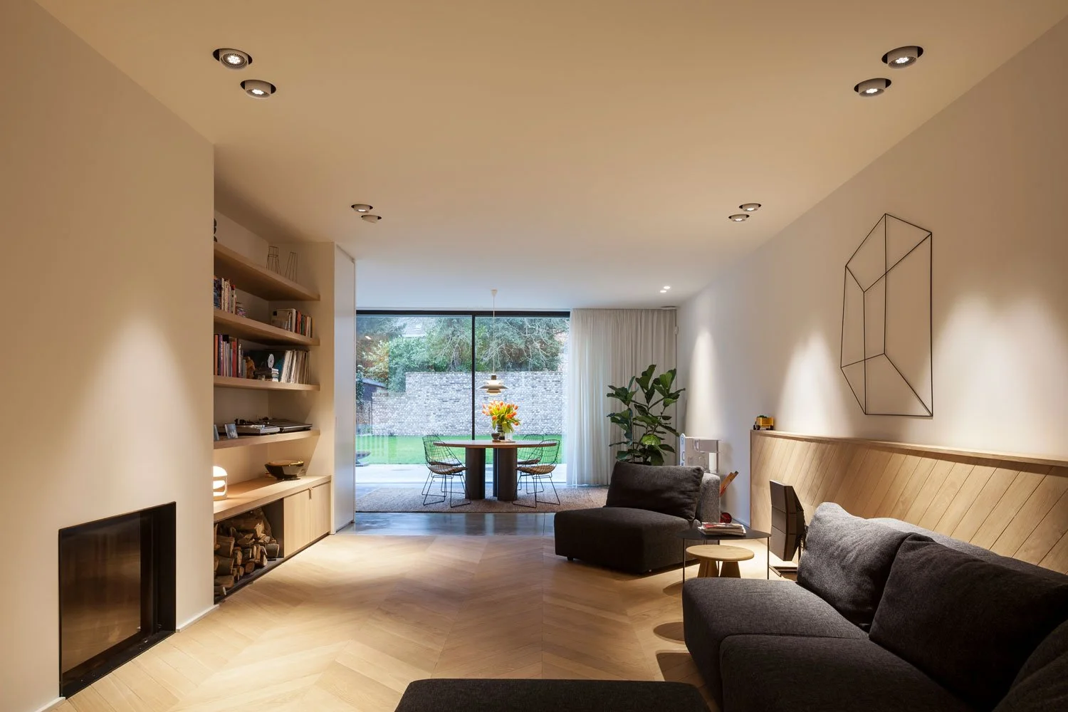  At the heart of the home, the open kitchen connects naturally to the living and dining areas, creating a generous shared space shaped around everyday family life. More intimate corners provide moments of privacy and retreat. 