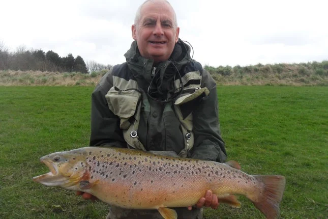 Matty Devine with his personal best 18lb 2oz brown caught on a Diawl Bach.