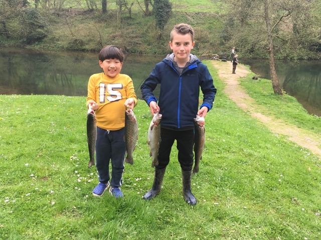 Wilbur Leoviriyakit (7) and Will Brooks (11) with their Bigwell fish.